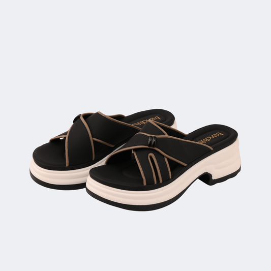 Black platform sandals with brown straps on a light gray background | Vogelle