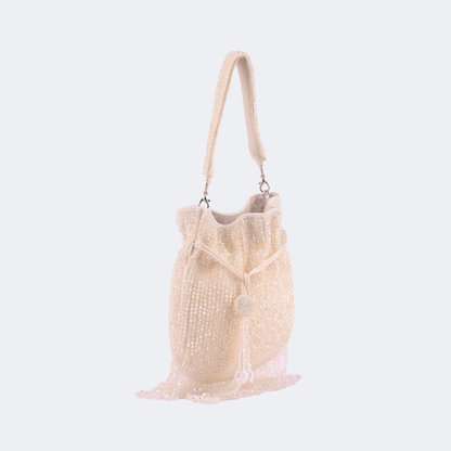 Beige handbag with lace details on a light gray background | Vogelle