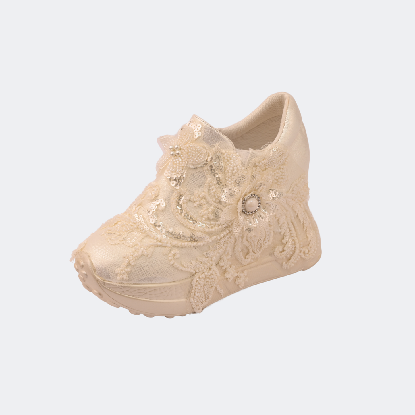Beige lace-up shoe with decorative elements on a light gray background | Vogelle