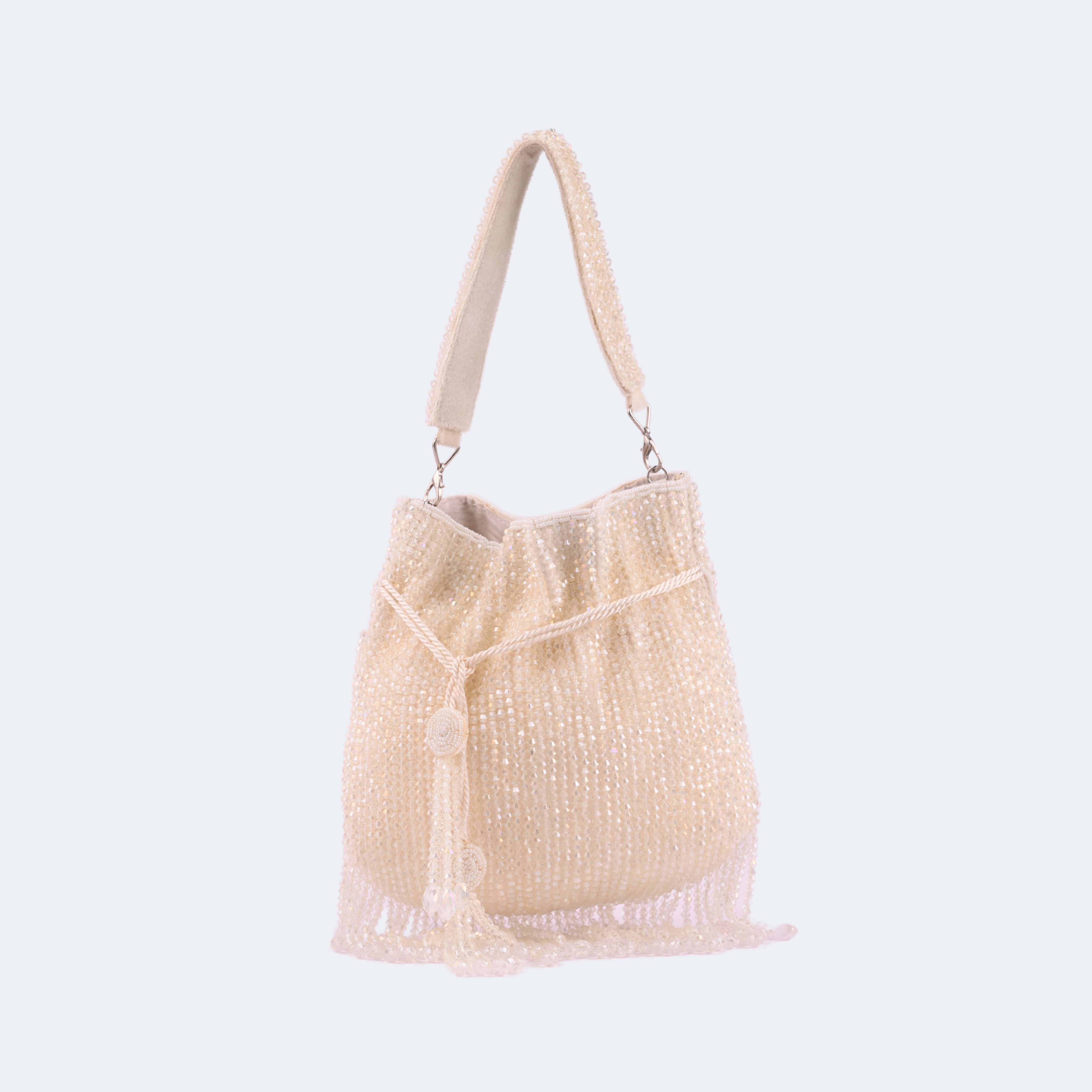 Beige woven handbag with a handle on a white background | Vogelle