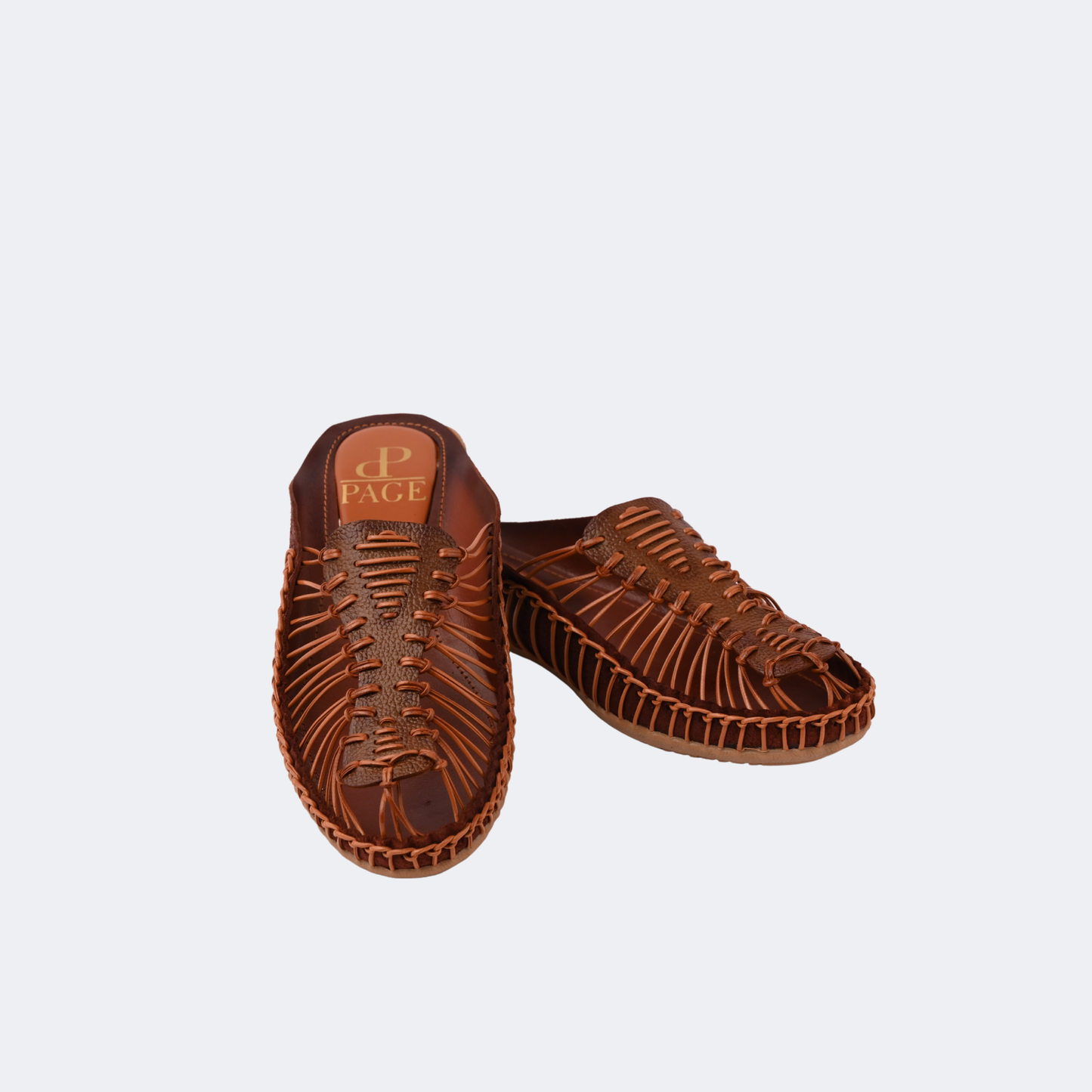 Pair of brown sandals on a light gray background | Vogelle