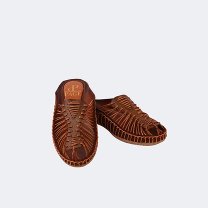 Pair of brown sandals on a light gray background | Vogelle
