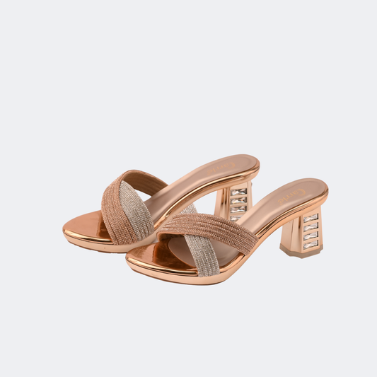 Pair of rose gold high-heeled sandals on a light gray background | Vogelle