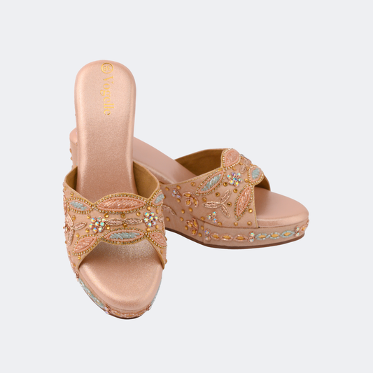 Pair of beige sandals with floral embroidery on a light gray background | Vogelle