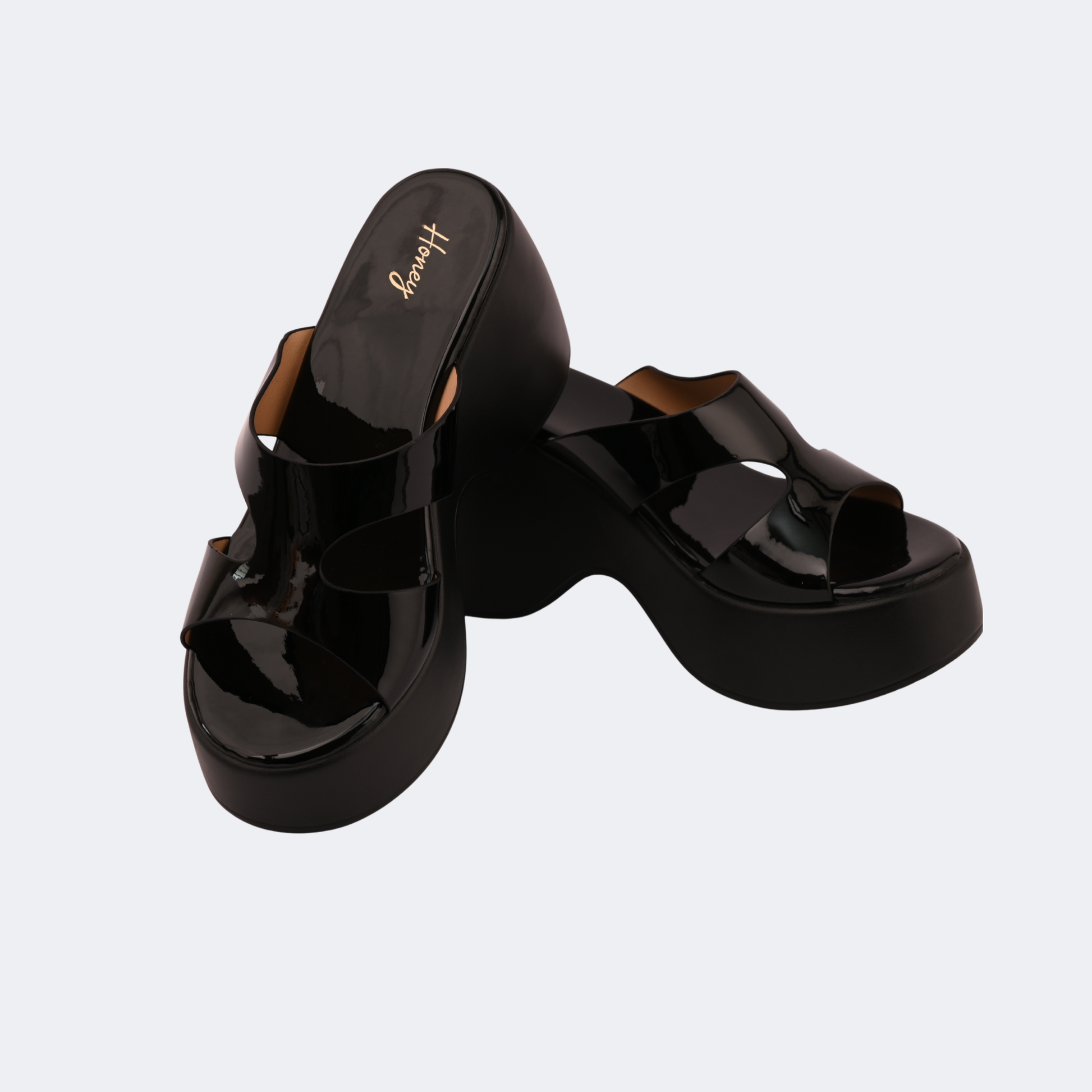 Black platform sandals on a light gray background | Vogelle