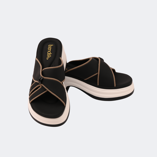 Black sandals with beige straps on a light gray background | Vogelle