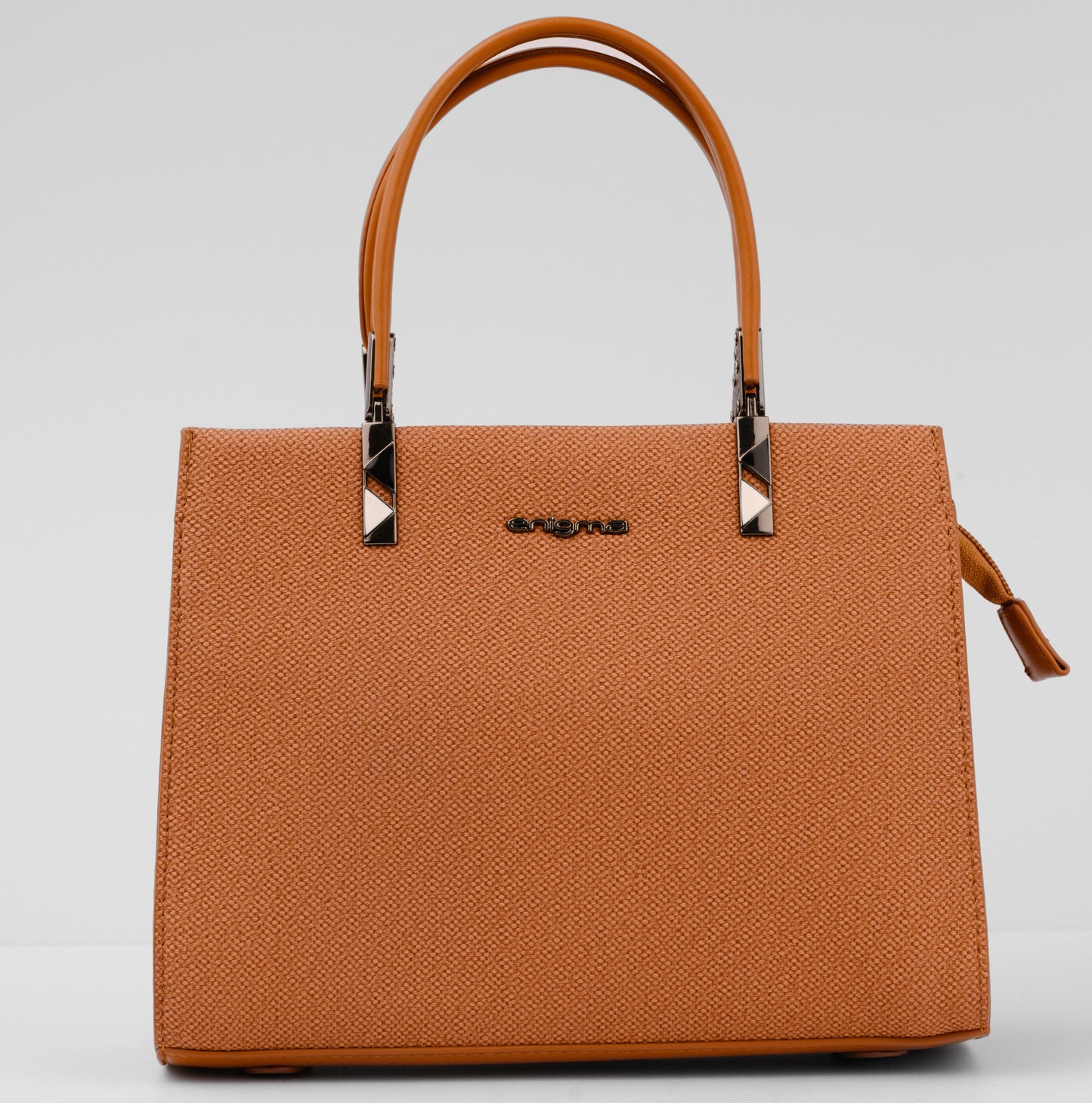 Brown handbag with a visible brand logo on a light gray background | Vogelle
