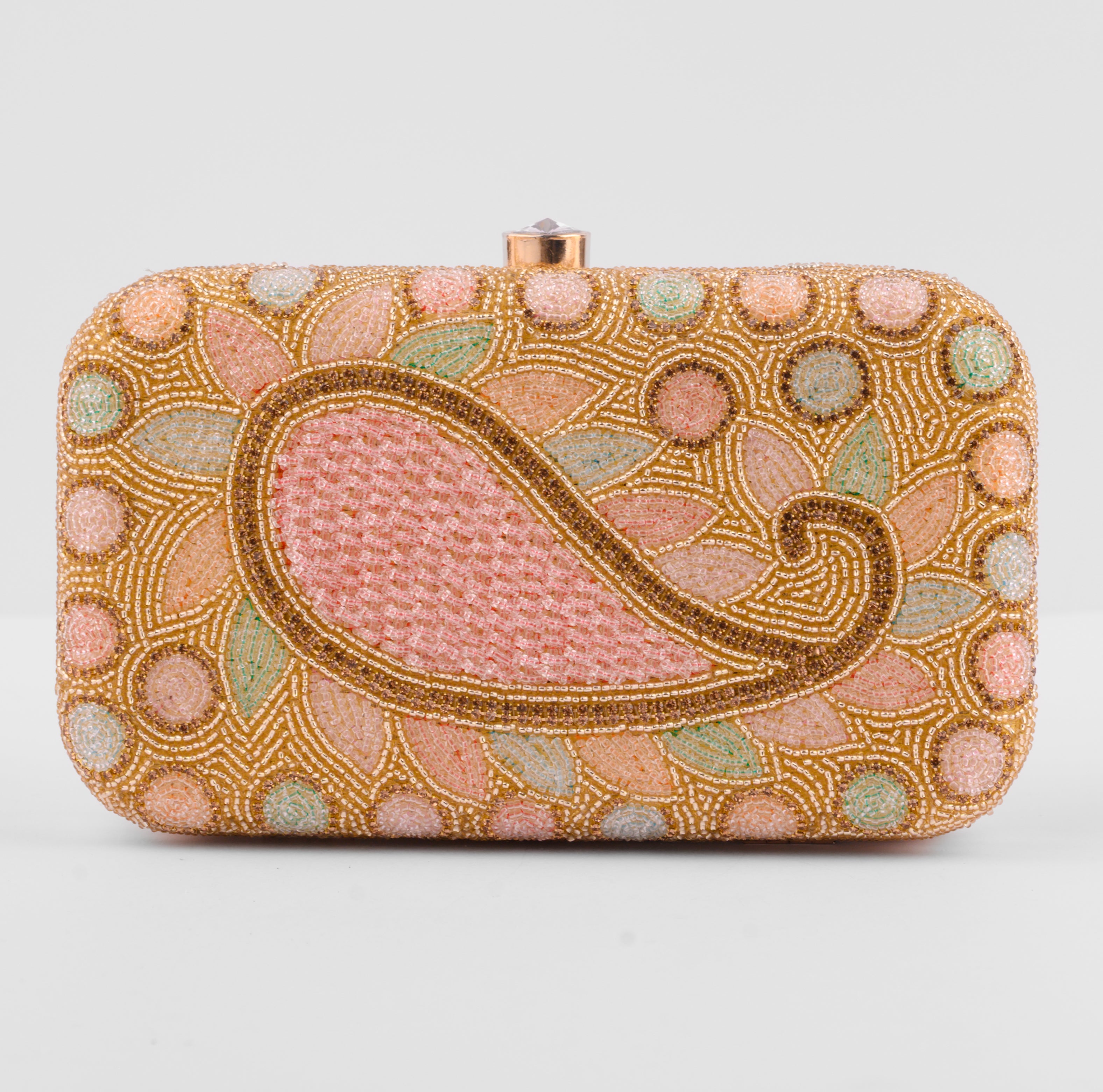 Decorative clutch bag with intricate beadwork on a light gray background | Vogelle