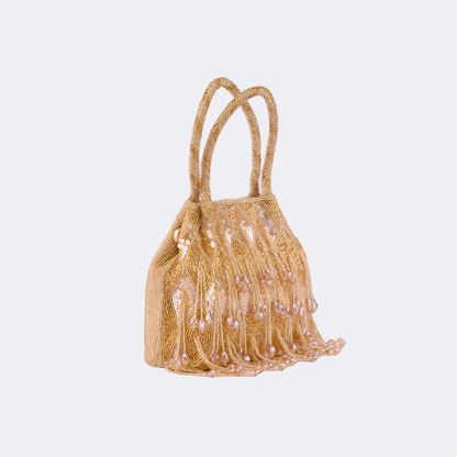 Gold beaded handbag with tassels on a light gray background | Vogelle