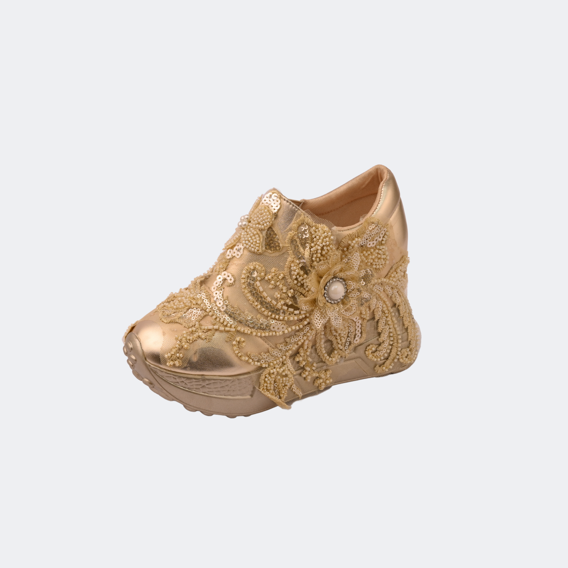 Gold embroidered shoe on a white background | Vogelle