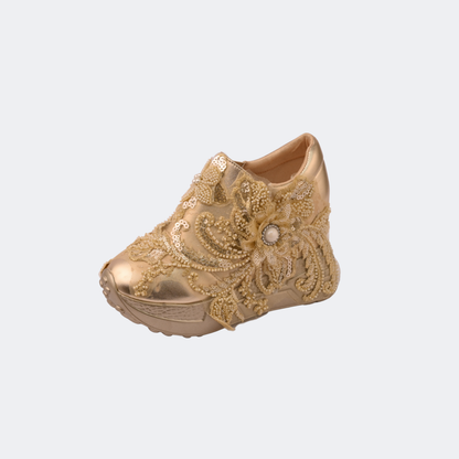 Gold embroidered shoe on a white background | Vogelle