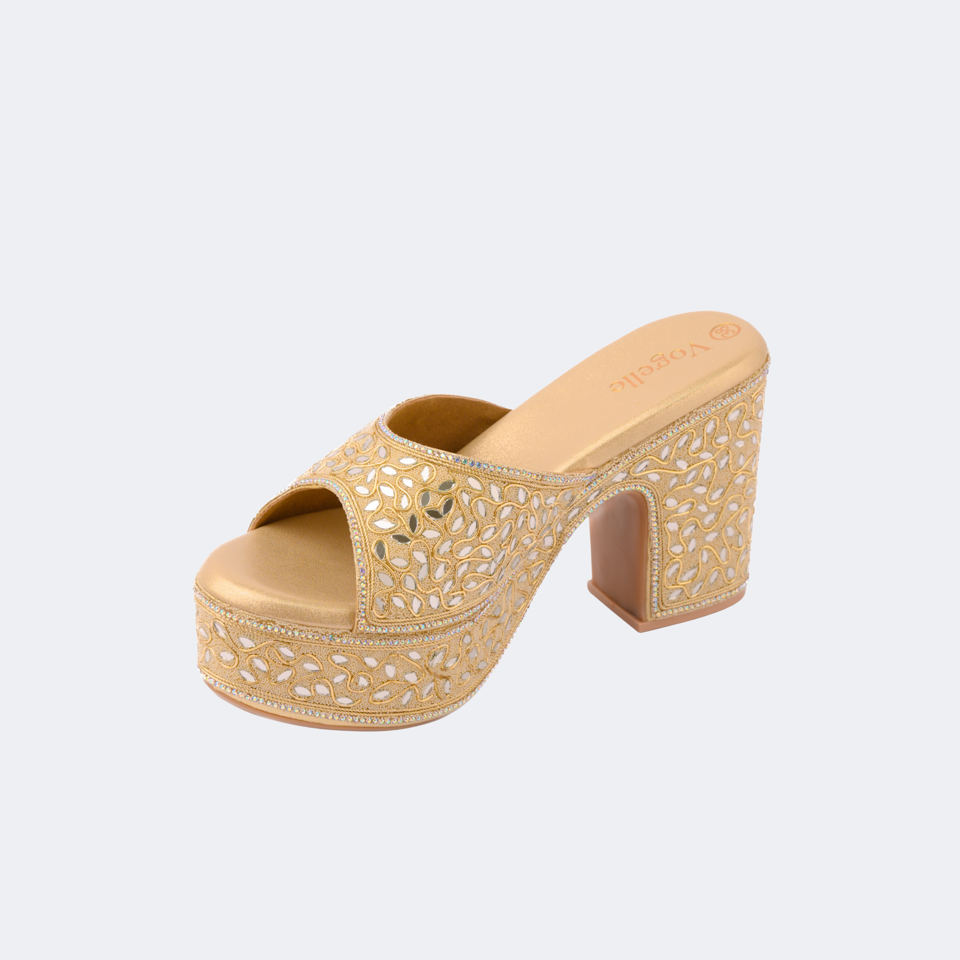 Gold platform sandal with intricate design on a light gray background | Vogelle
