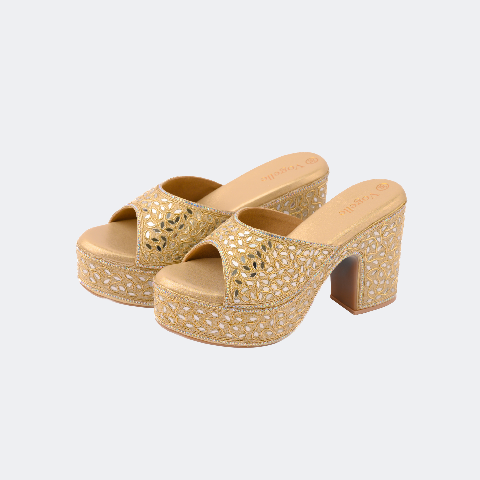Gold platform sandals with cut-out design on a light gray background | Vogelle