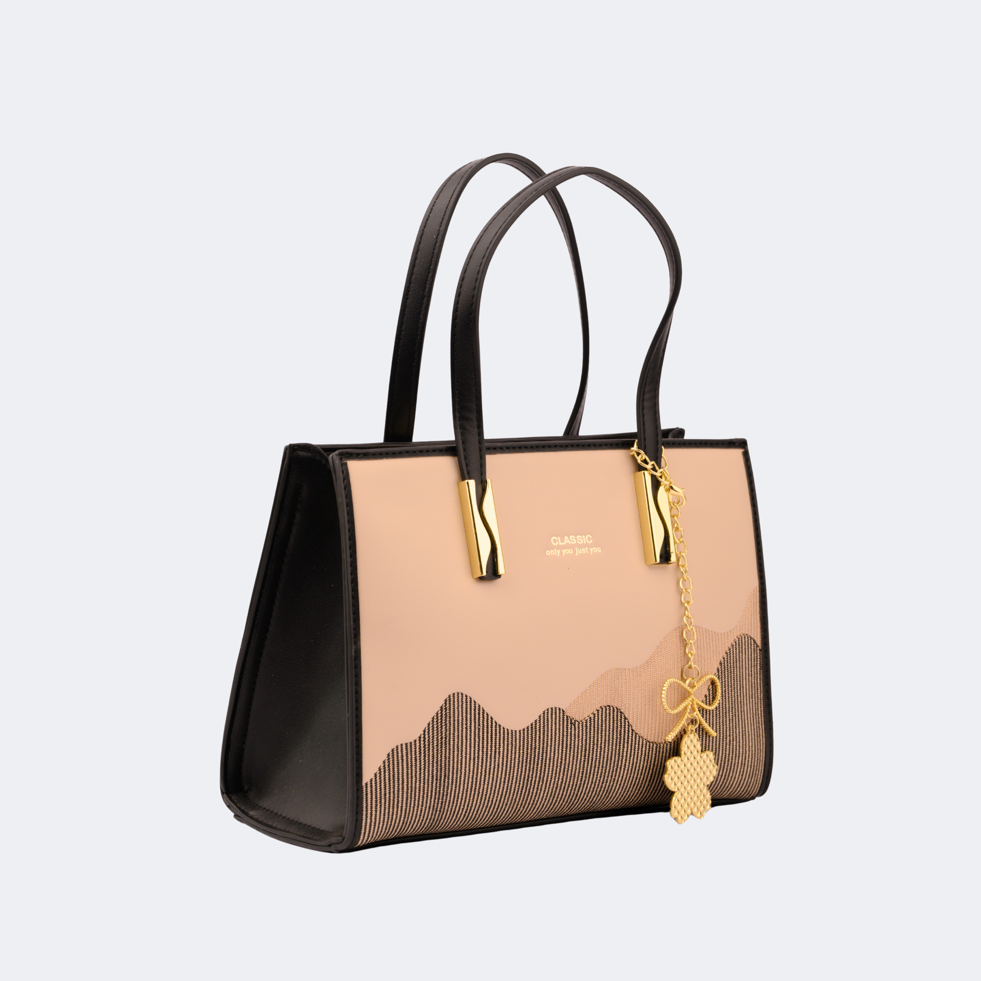 Handbag with black and beige design on a light gray background | Vogelle