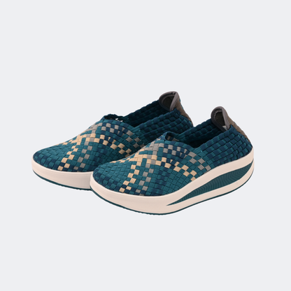 Pair of blue woven sneakers on a light gray background | Vogelle