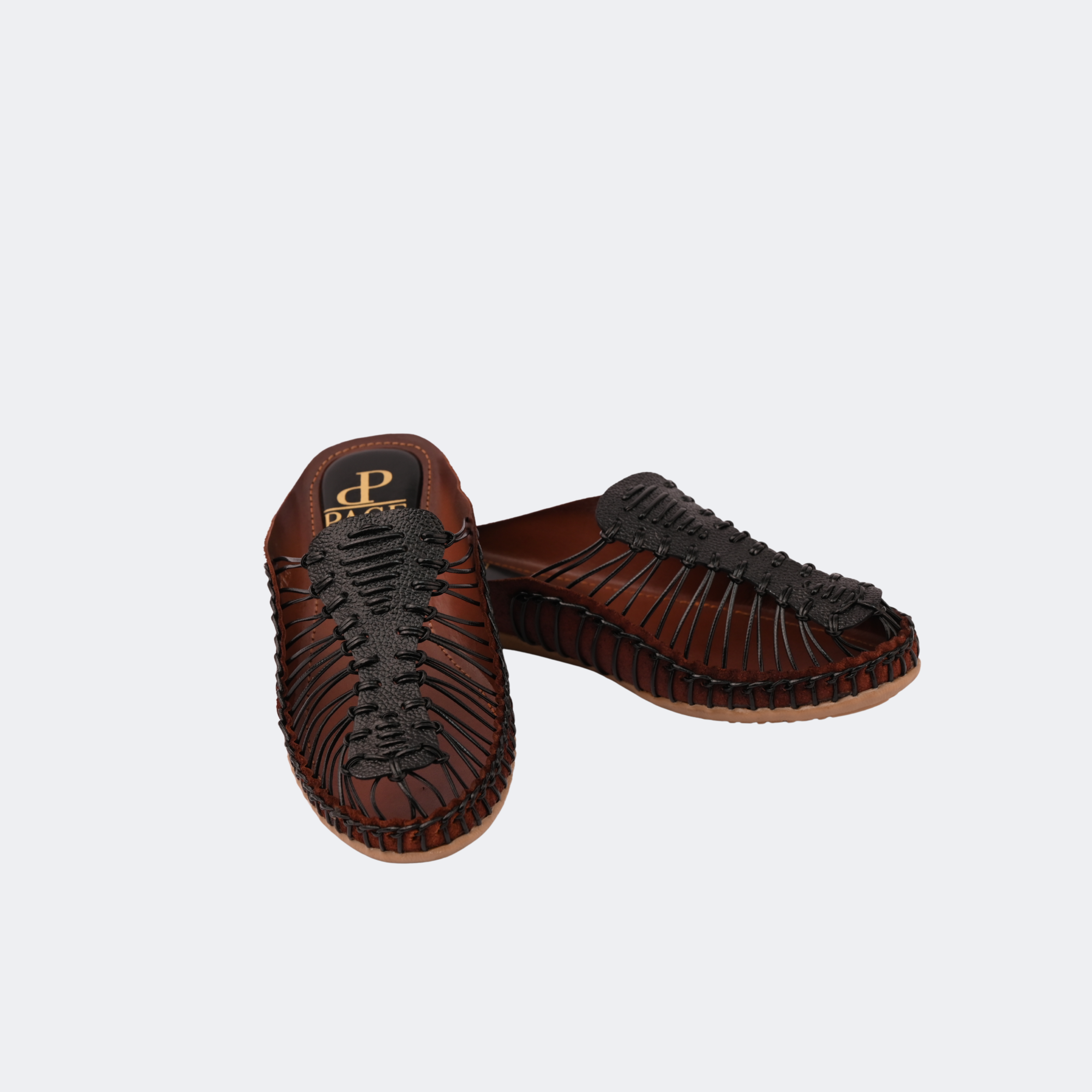 Pair of brown sandals with woven design on a light gray background | Vogelle