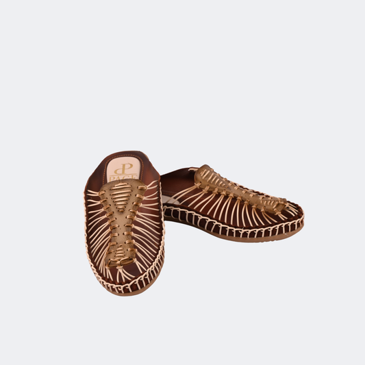Pair of brown woven sandals on a light gray background