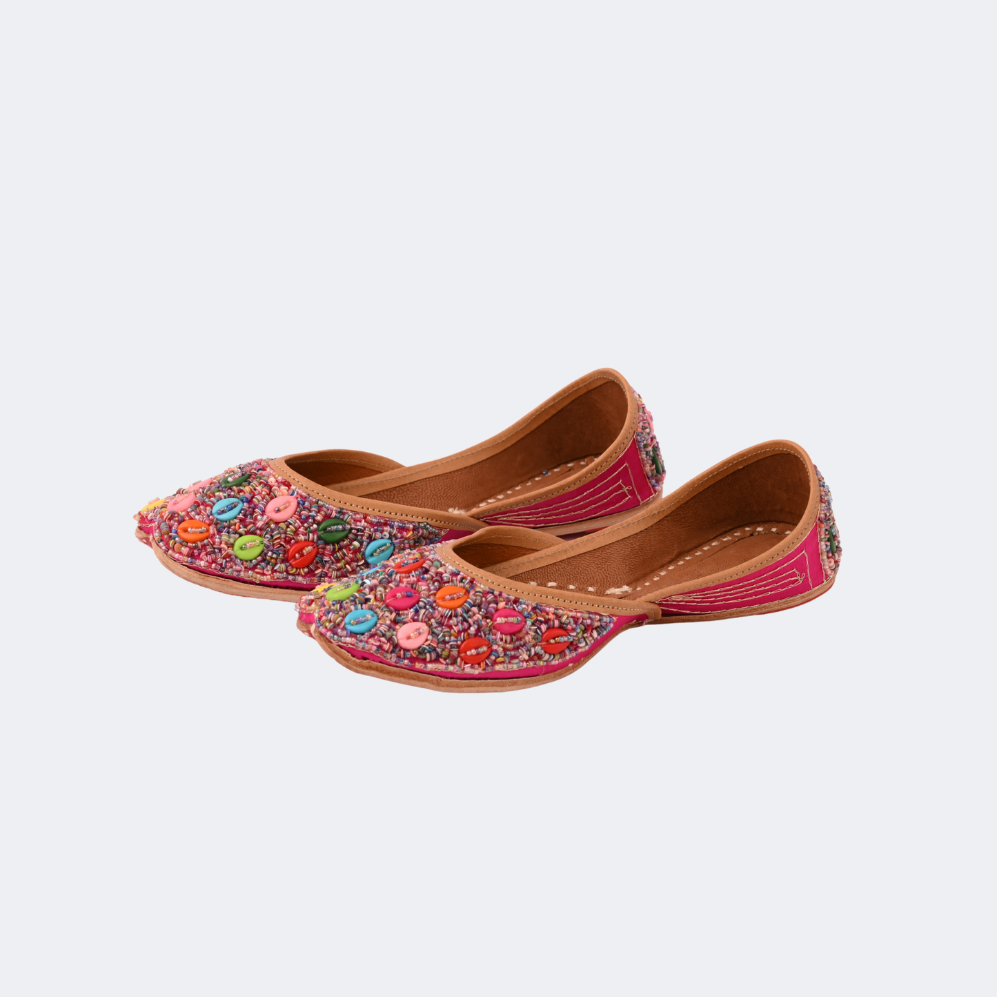Pair of colorful embroidered shoes on a light gray background | Vogelle