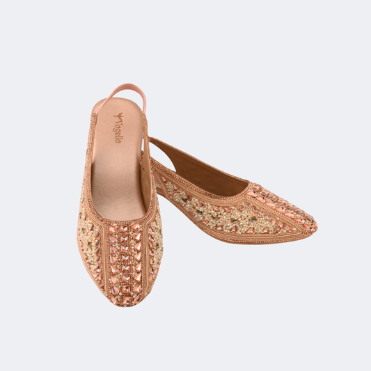 Pair of embellished shoes on a light gray background | Vogelle