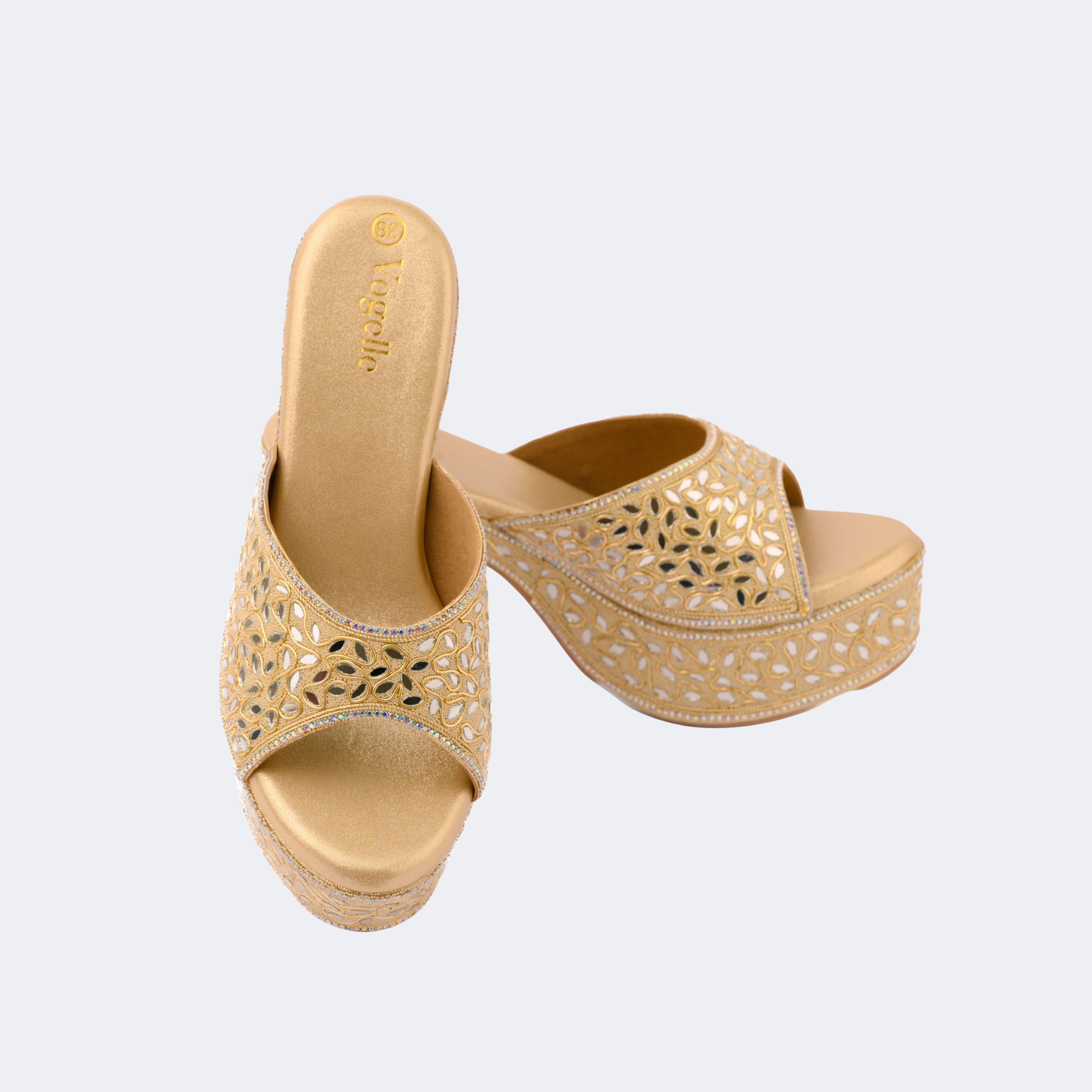 Pair of gold sandals with cut-out design on a light gray background | Vogelle