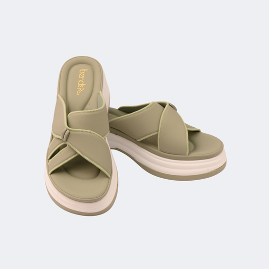 Pair of green sandals with white soles on a light gray background | Vogelle
