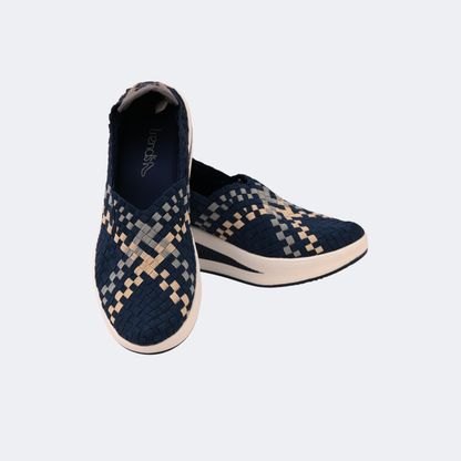 Pair of navy and beige checkered slip-on shoes on a white background | Vogelle