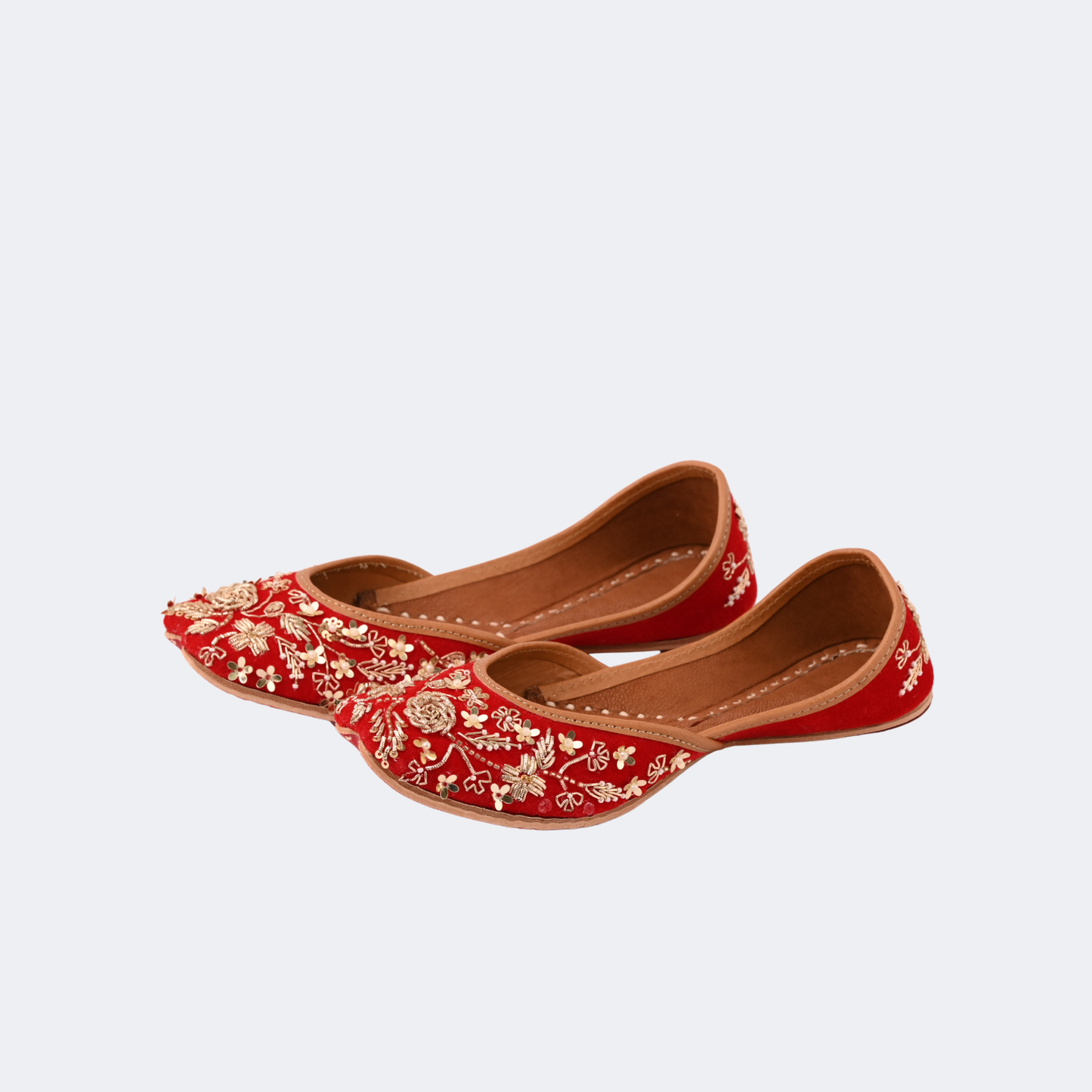 Pair of red floral embroidered shoes on a light gray background | Vogelle
