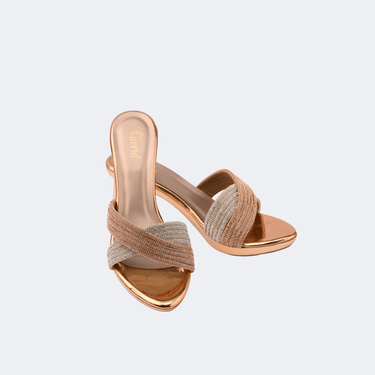 Pair of rose gold high-heeled sandals on a light gray background | Vogelle
