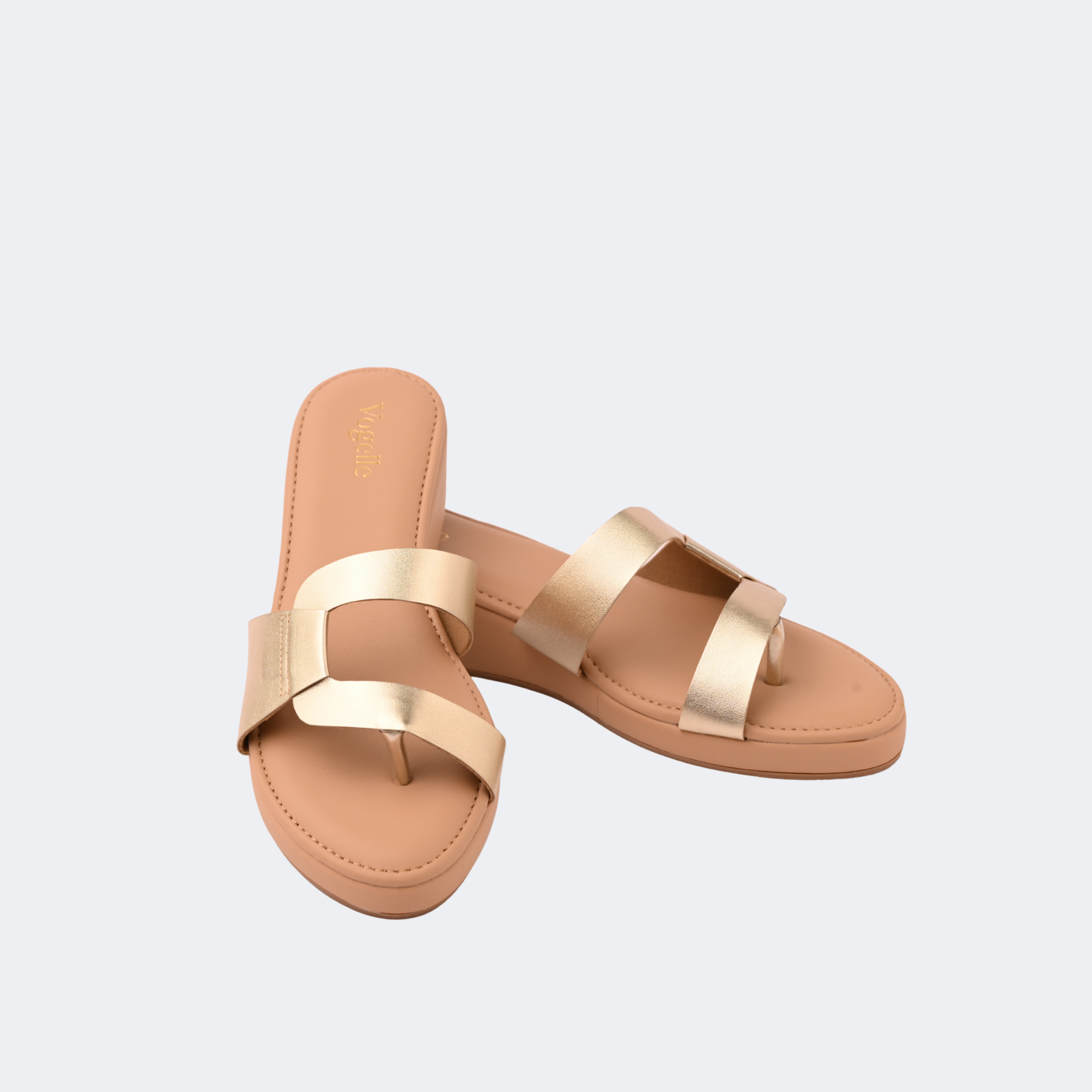 Pair of tan sandals with gold straps on a light gray background | Vogelle