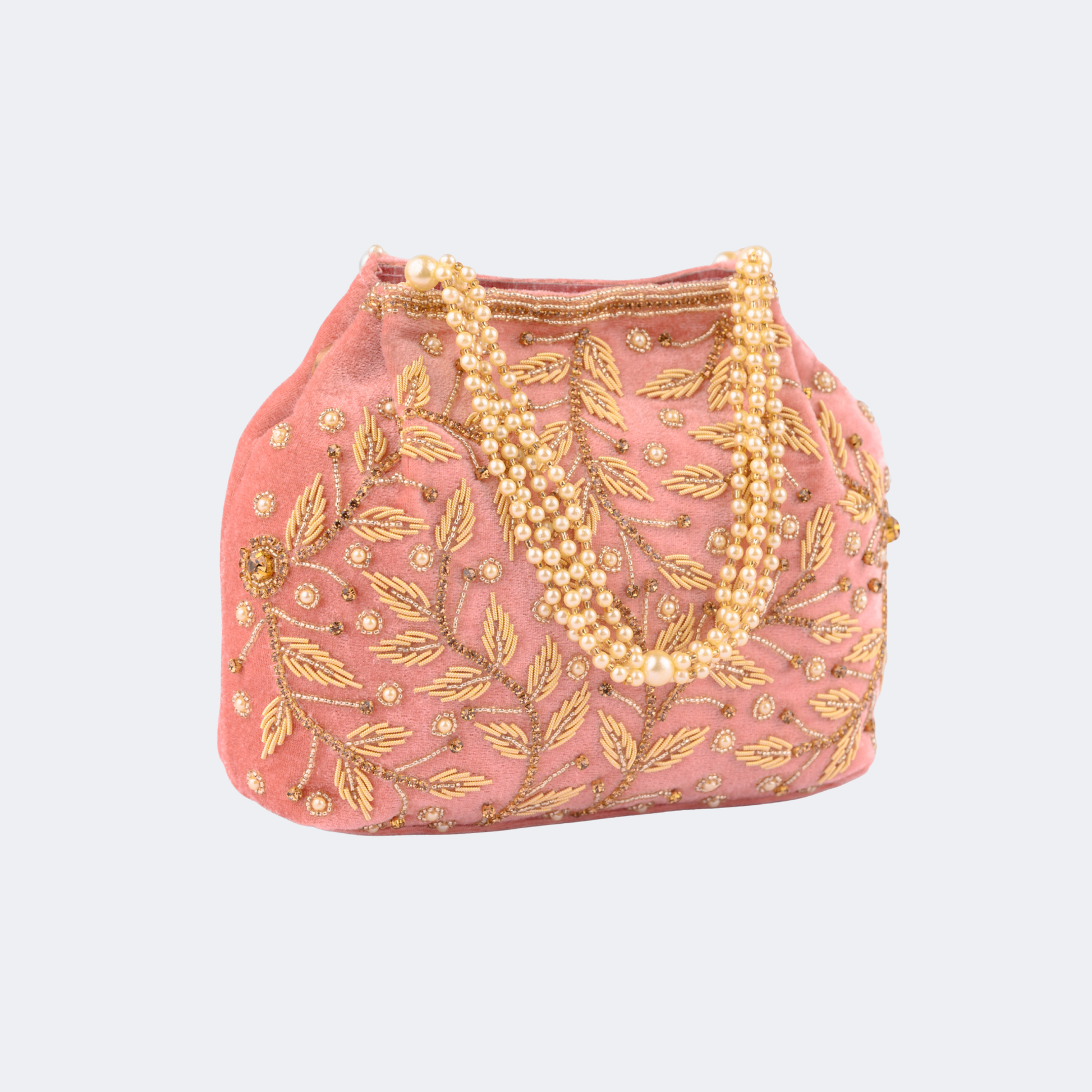 Pink handbag with gold embroidery and pearl strands on a white background | Vogelle