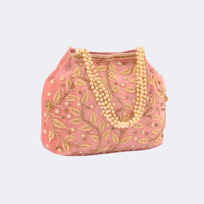 Pink handbag with gold embroidery and pearl strands on a white background | Vogelle