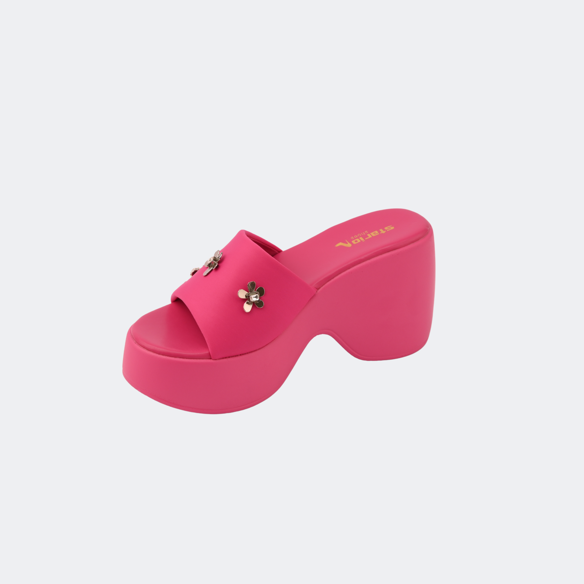 Pink platform sandal with a decorative flower on a light gray background | Vogelle