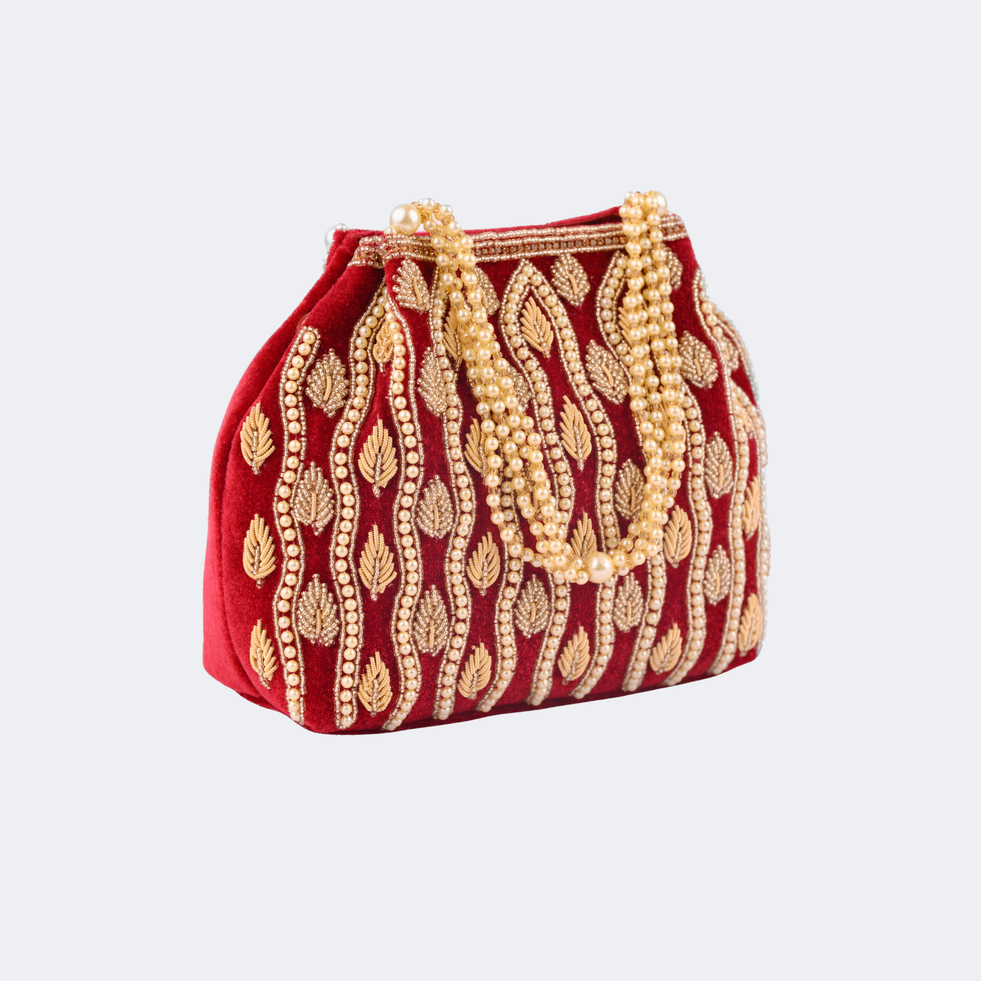 Red handbag with gold embroidery on a light gray background | Vogelle