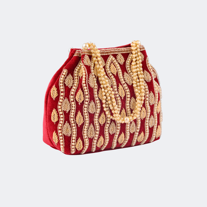 Red handbag with gold embroidery on a light gray background | Vogelle