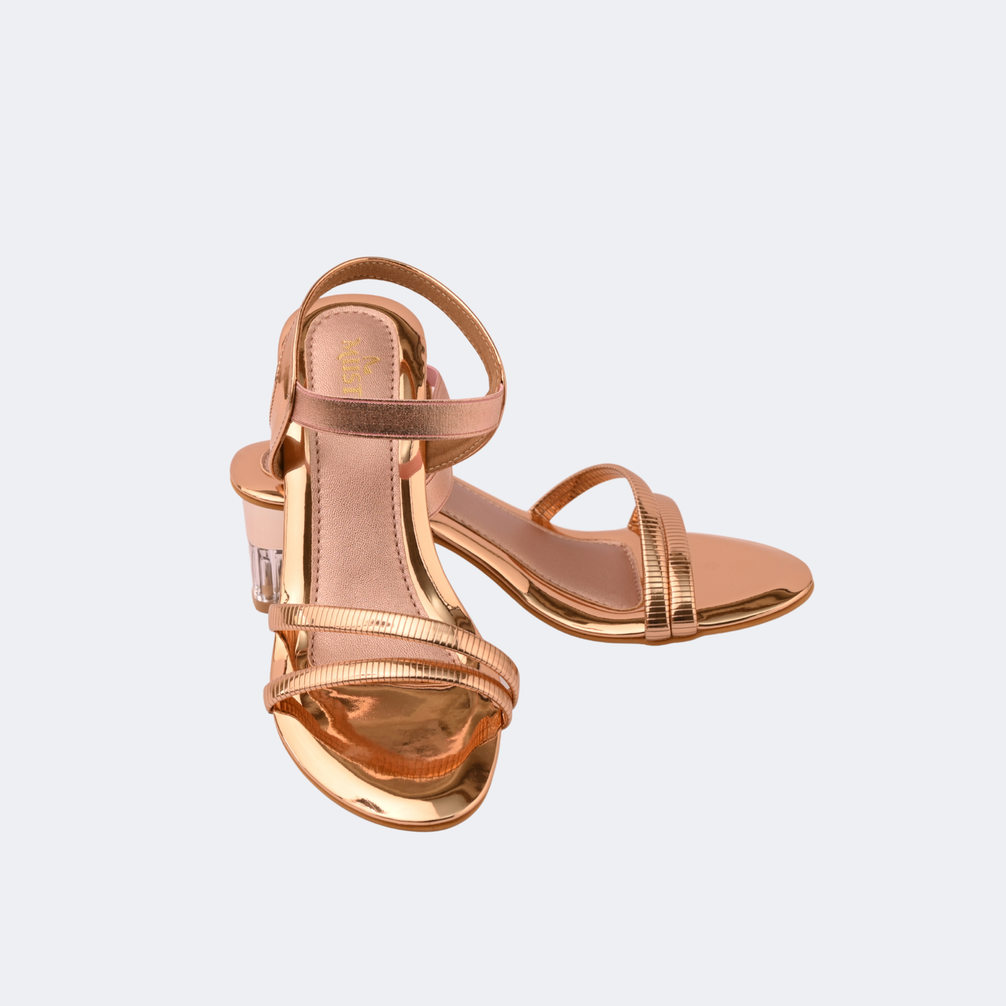 Rose gold high-heeled sandals on a light gray background | Vogelle