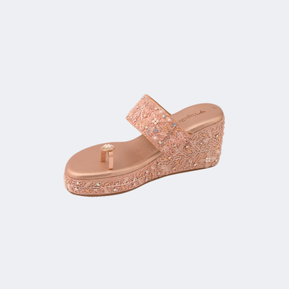 Rose gold wedge sandal with floral pattern on a light gray background | Vogelle
