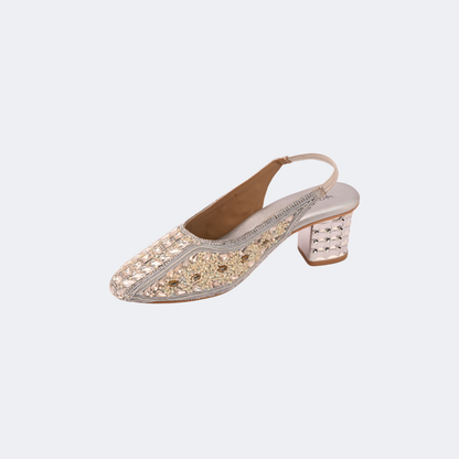 Sparkly sandal with decorative sole on a light gray background | Vogelle