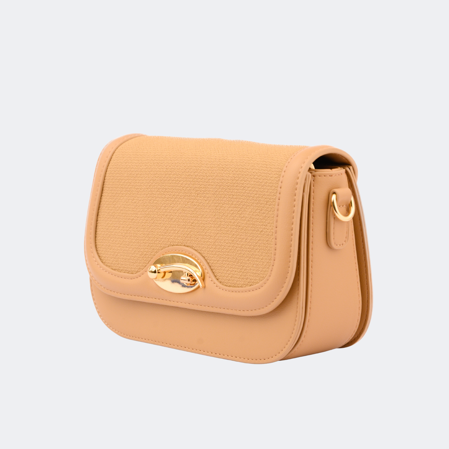 Beige handbag with gold accents on a light gray background | Vogelle