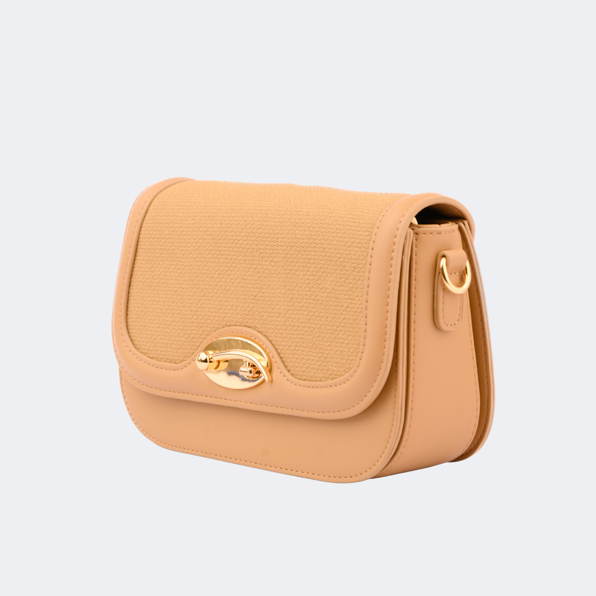 Beige handbag with gold accents on a light gray background | Vogelle