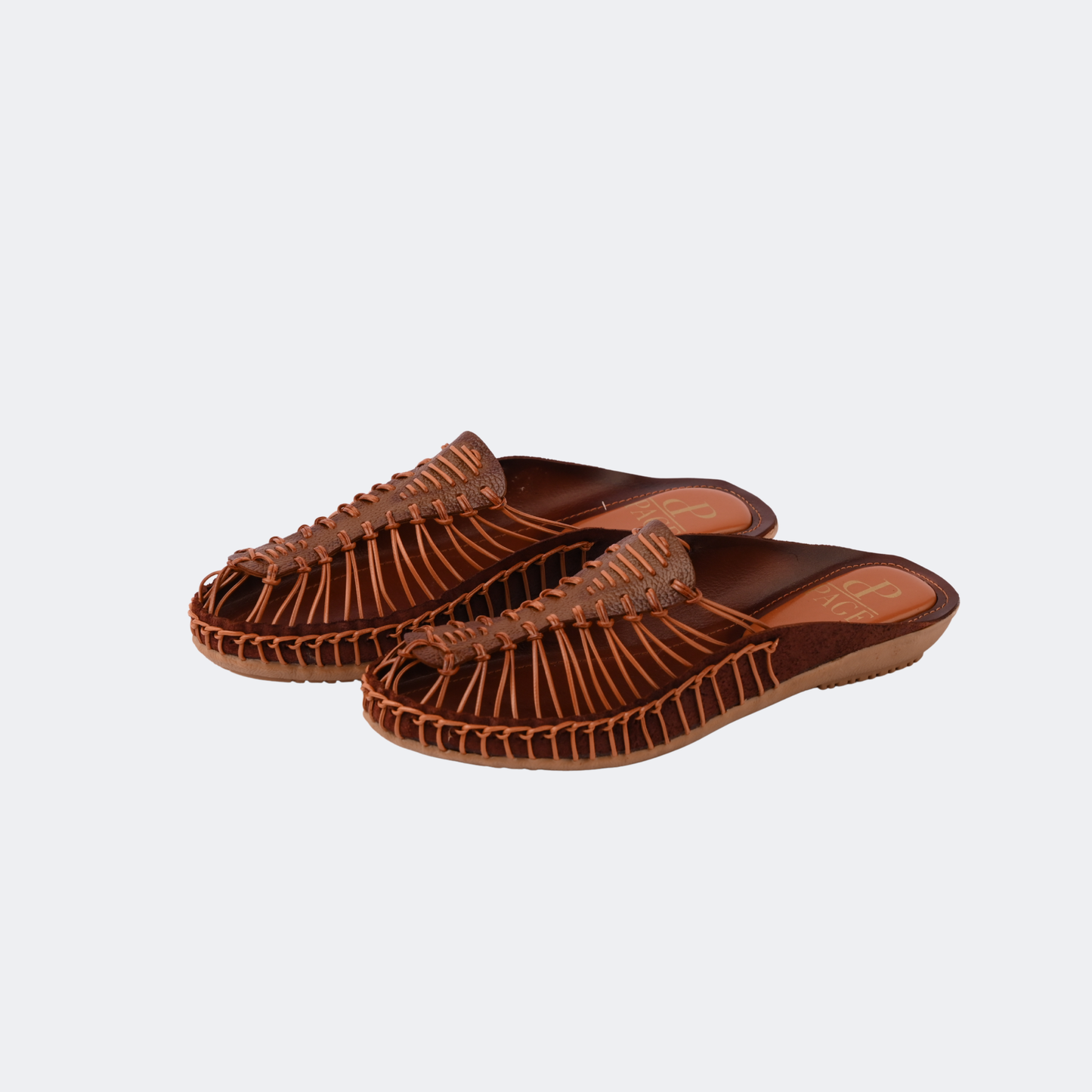 Pair of brown sandals on a light gray background |Vogelle