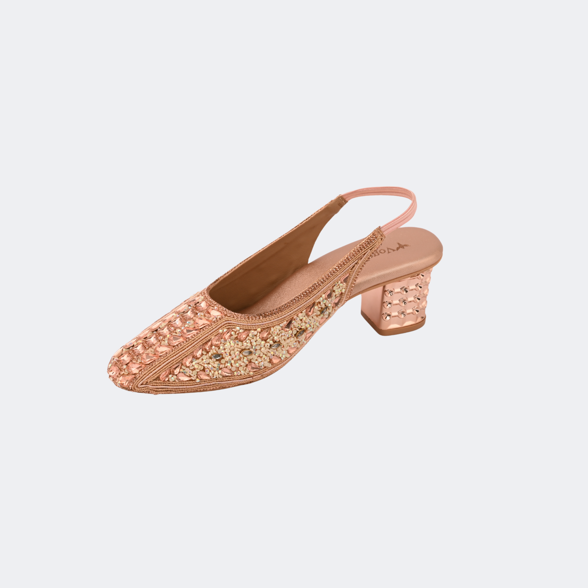 Rose gold embellished shoe on a light gray background | Vogelle