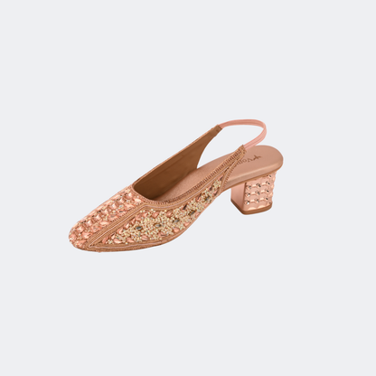 Rose gold embellished shoe on a light gray background | Vogelle
