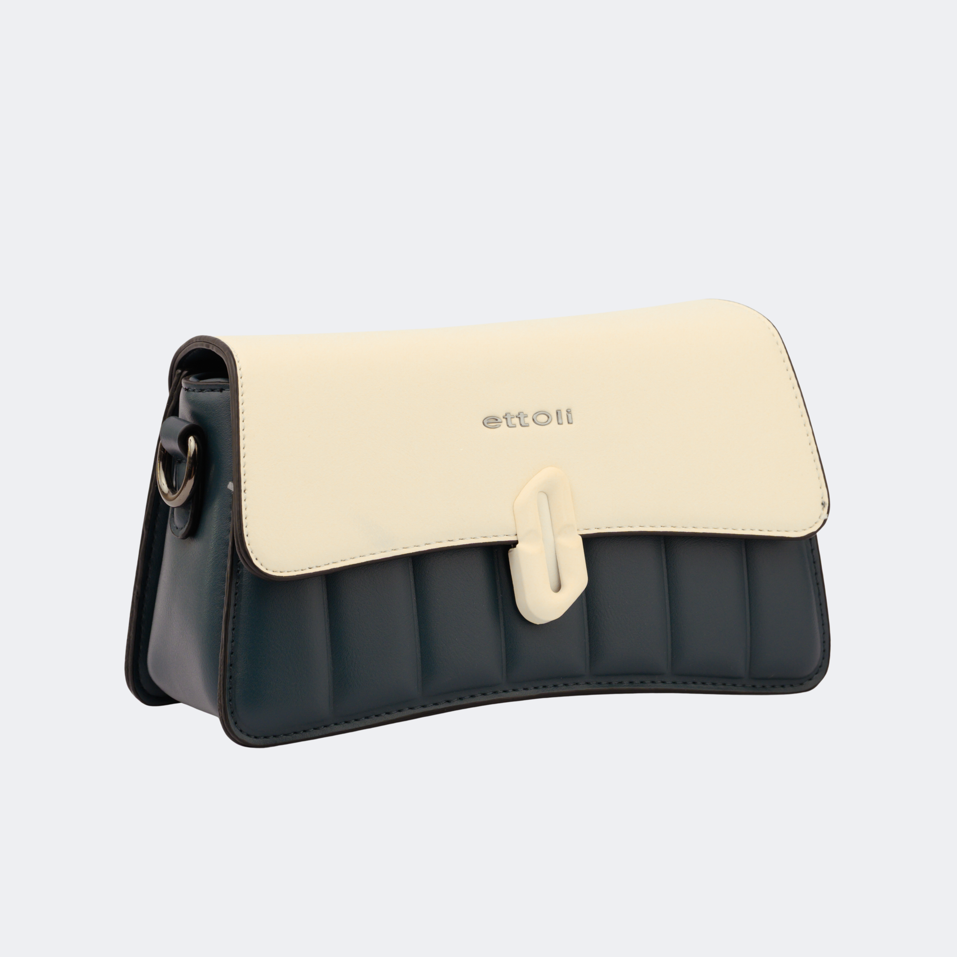 Two-tone handbag with beige top section and black bottom section on a light gray background | Vogelle