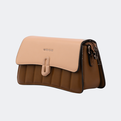 Two-tone handbag with beige top section and brown bottom section on a light gray background | Vogelle