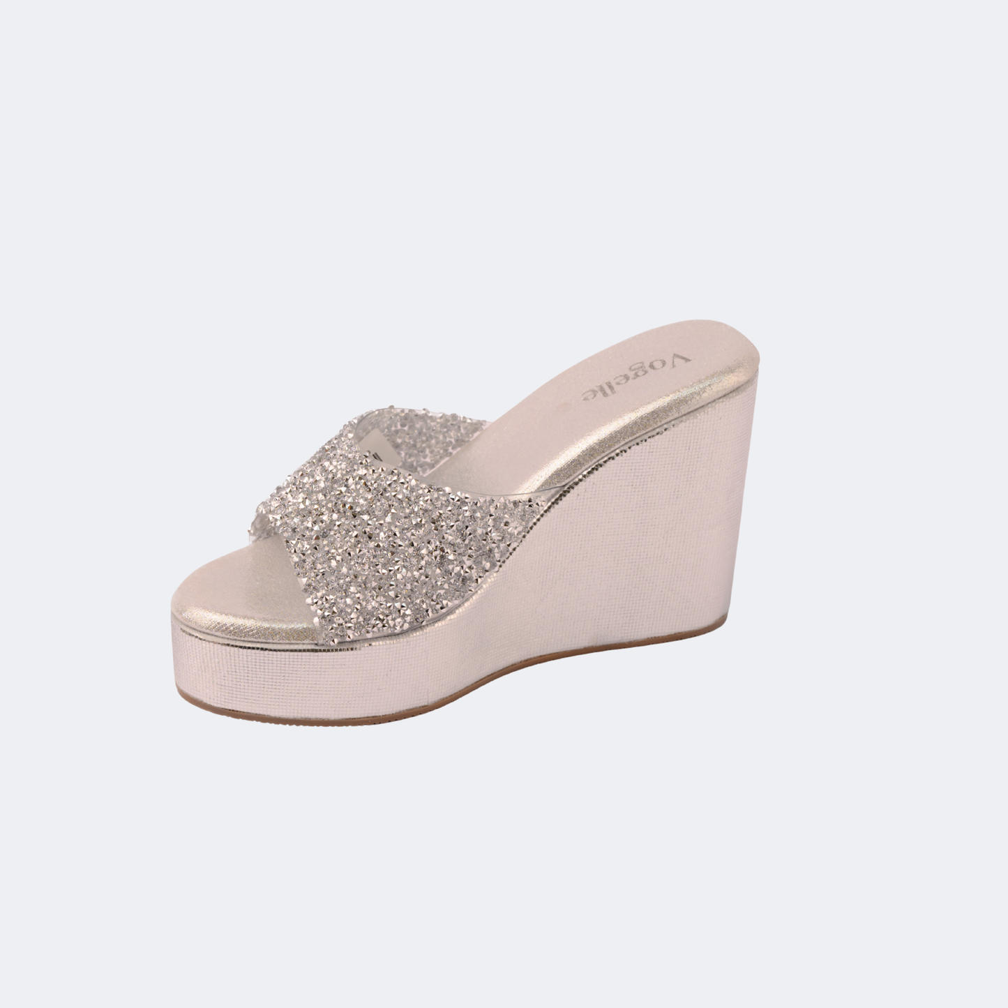 Wedge sandal with glittery strap on a light gray background | Vogelle