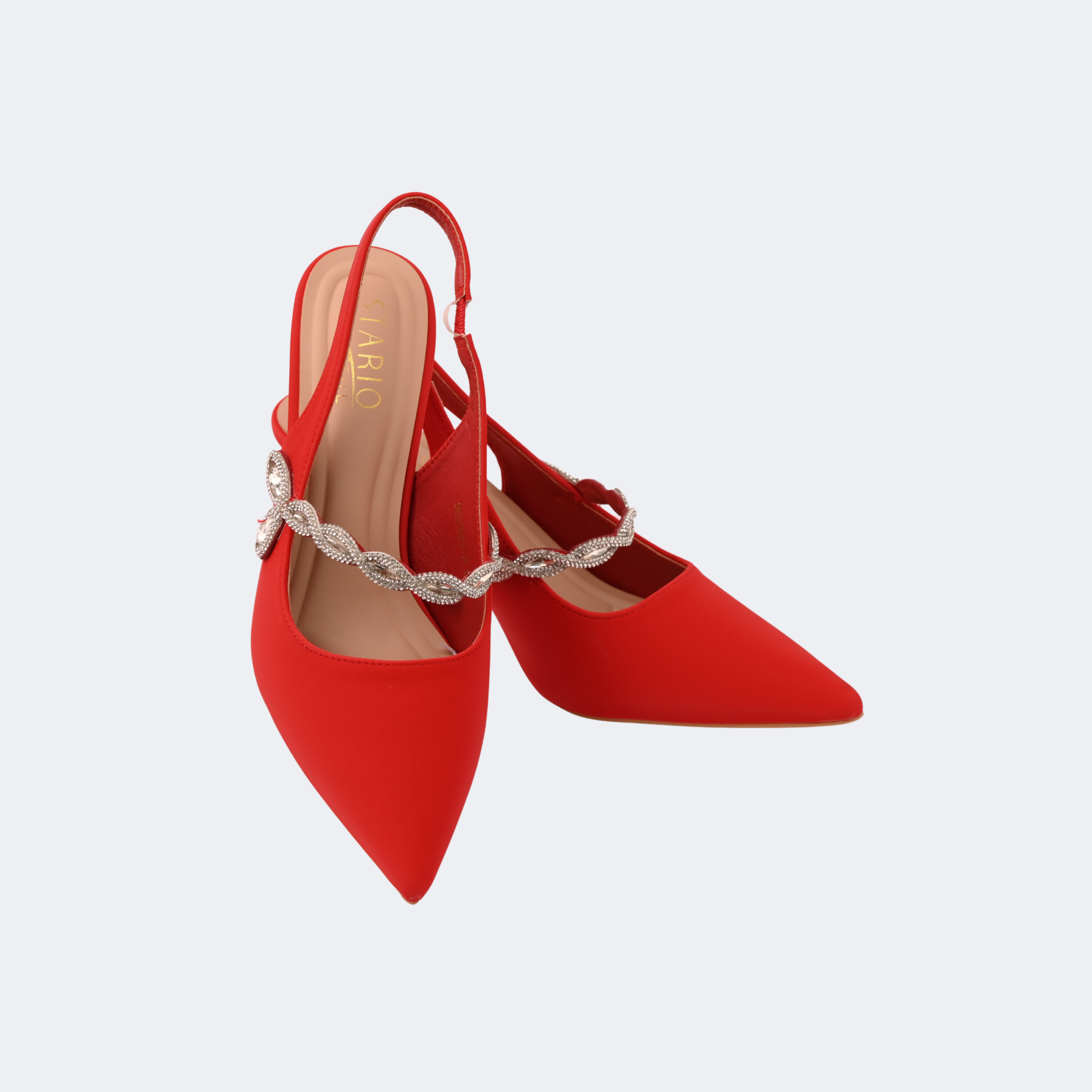Red high-heeled shoes with a decorative strap on a light gray background | Vogelle