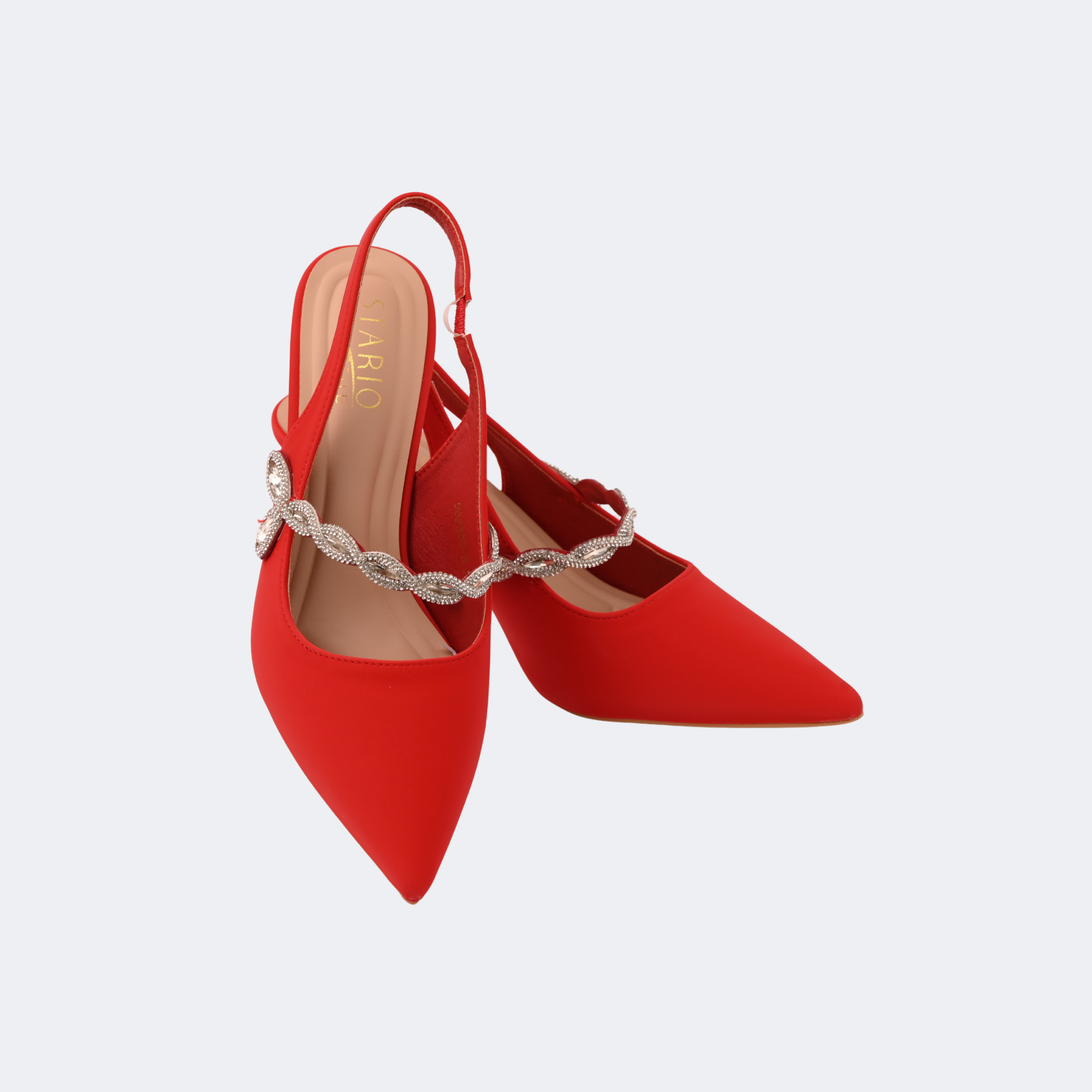 Red high-heeled shoes with a decorative strap on a light gray background | Vogelle