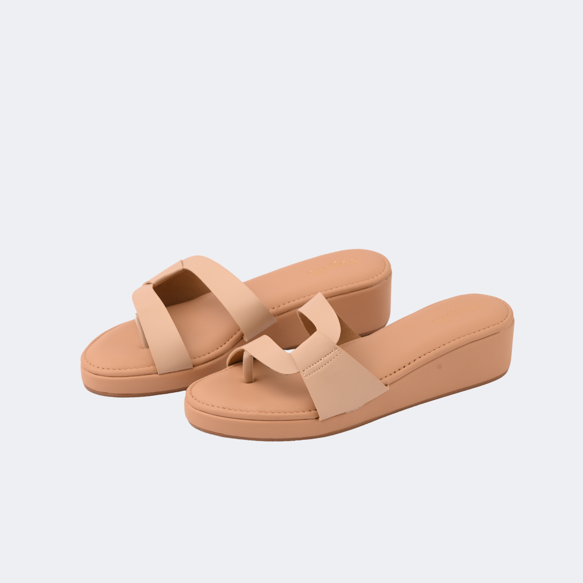Pair of beige sandals on a light gray background | Vogelle