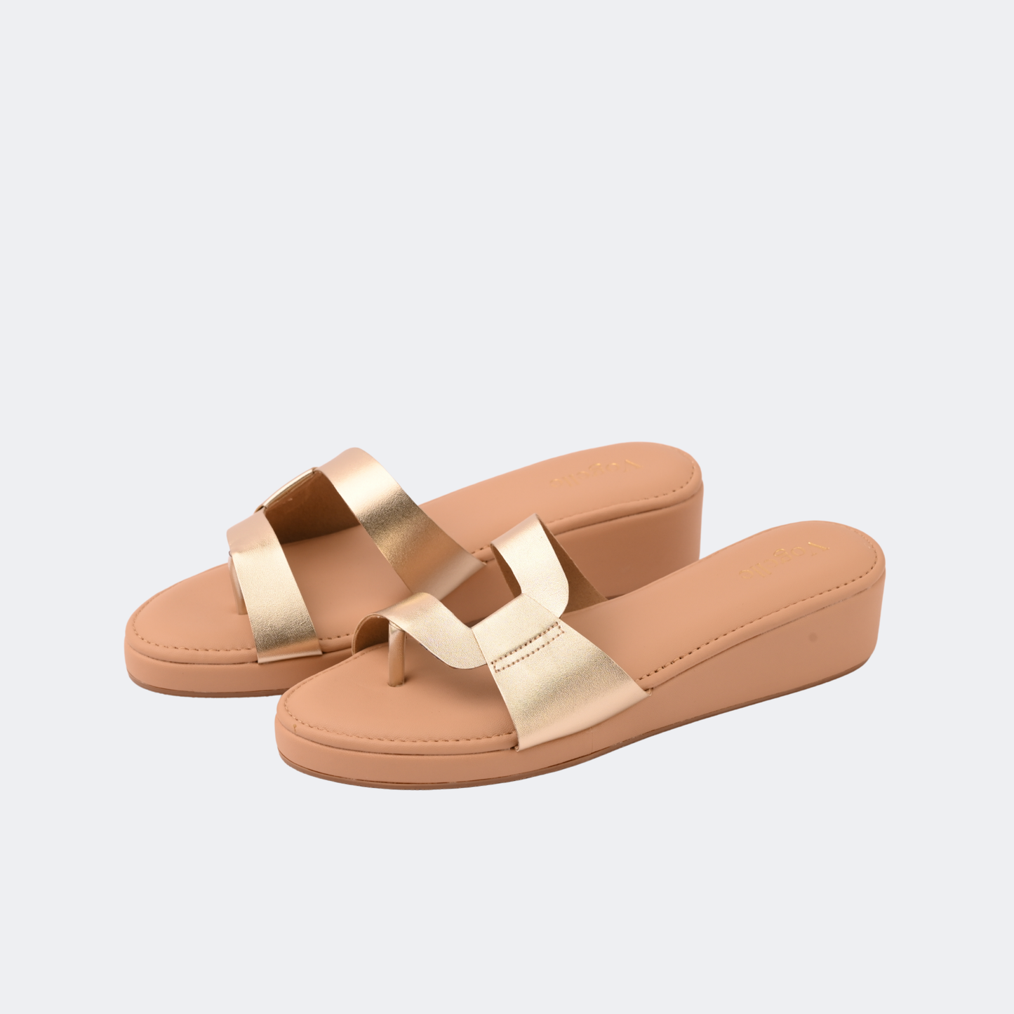 Tan sandals with gold straps on a light gray background | Vogelle