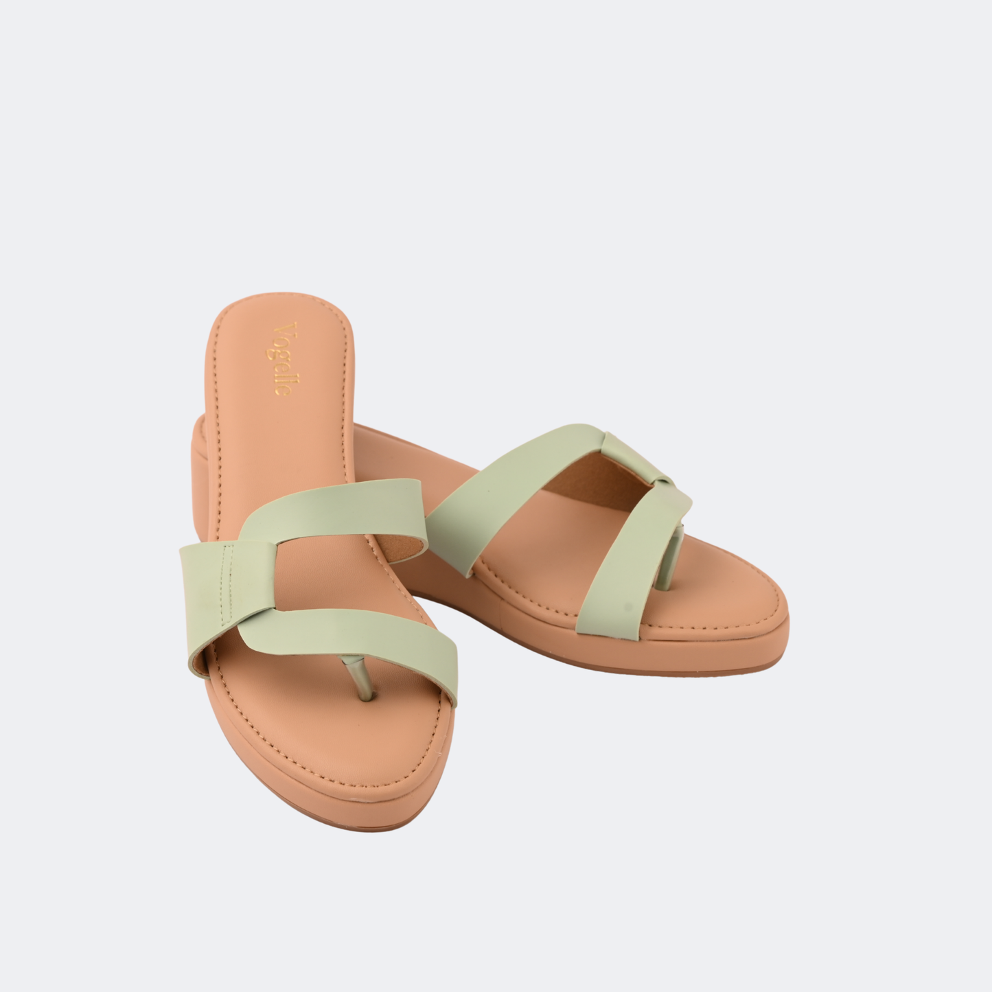 Pair of tan sandals with light green straps on a white background | Vogelle